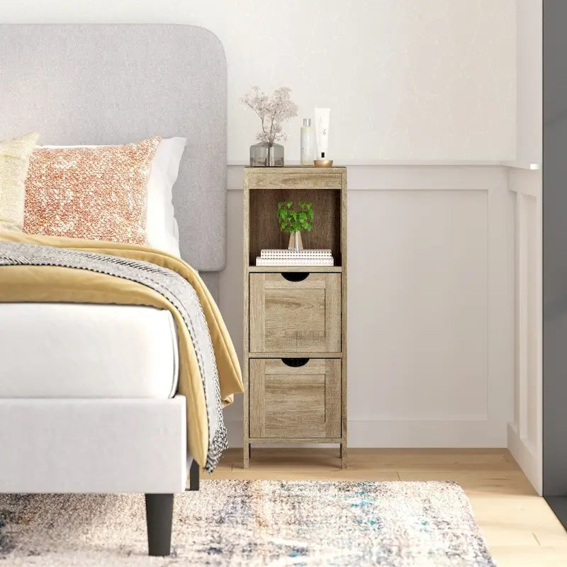 Meuble de rangement au sol avec 2 tiroirs, une étagère ouverte et des patins de protection.