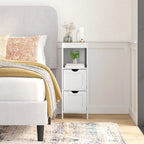 Meuble de rangement au sol avec 2 tiroirs, une étagère ouverte et des patins de protection.