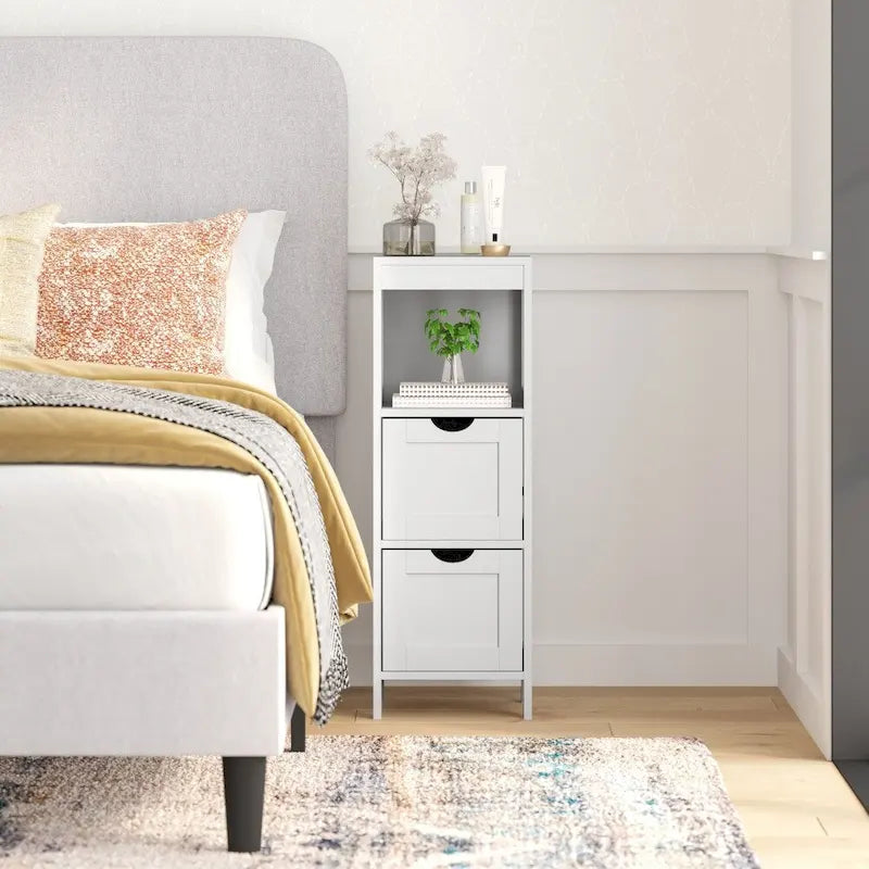 Meuble de rangement au sol avec 2 tiroirs, une étagère ouverte et des patins de protection.